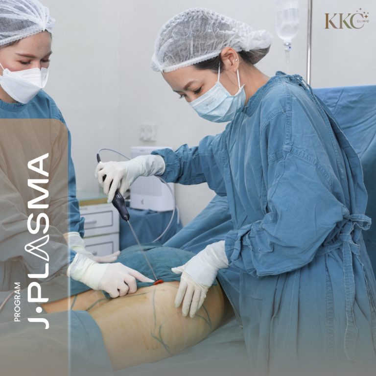 Two doctors performing a J-Plasma procedure on a patient's thigh.