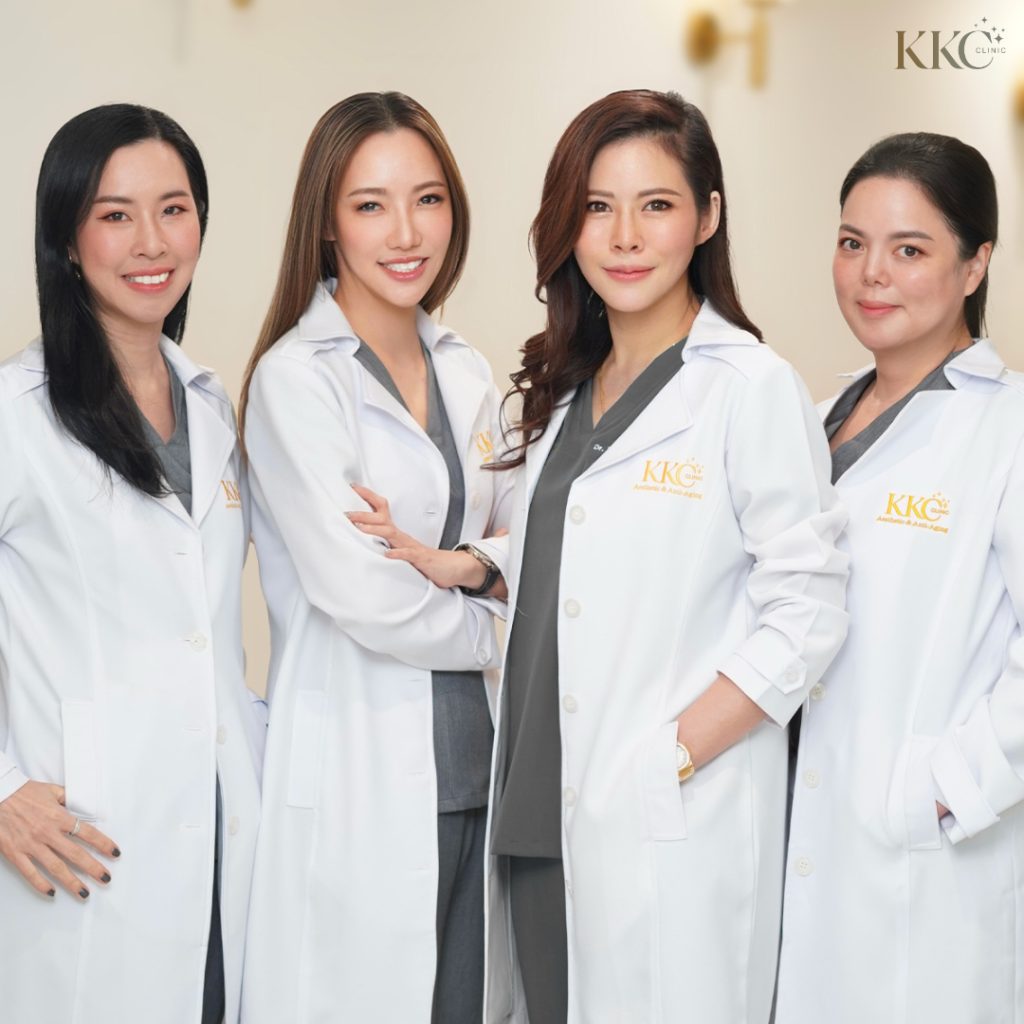 From left to right: Dr. Karn Limbanyen, Dr. Woravan Techasomboon, Dr. Khongkwan Fujitnirun, and Dr. Chantamon Laochariyakul—founding doctors of KKC Clinic wearing white coats and smiling.